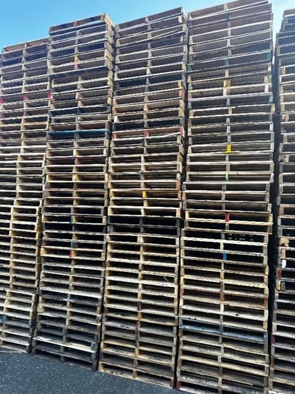 Stacks of wooden pallets at Magic Pallets yard